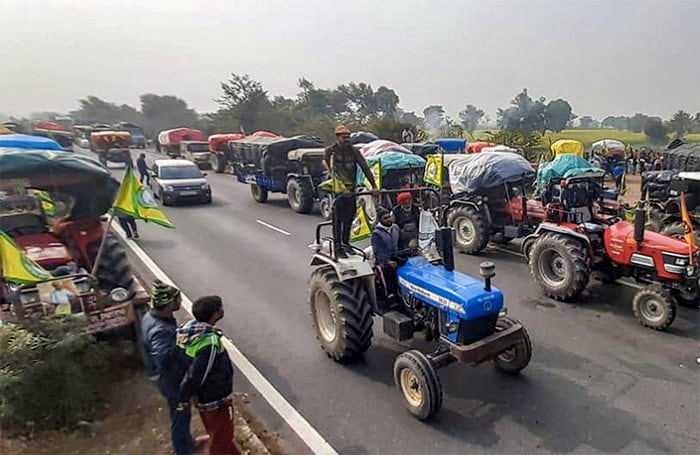 Farmers from Punjab, Haryana, and Rajasthan heading towards Delhi, to join the main agitation against the Center's farm laws, reached Masani Barrage on Delhi-Jaipur National Highway in Rewari district, Monday.