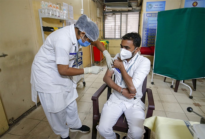 A health worker takes part in a dry run as part of preparedness for the administration of COVID-19 vaccine at Civil Hospital in Ahmedabad.