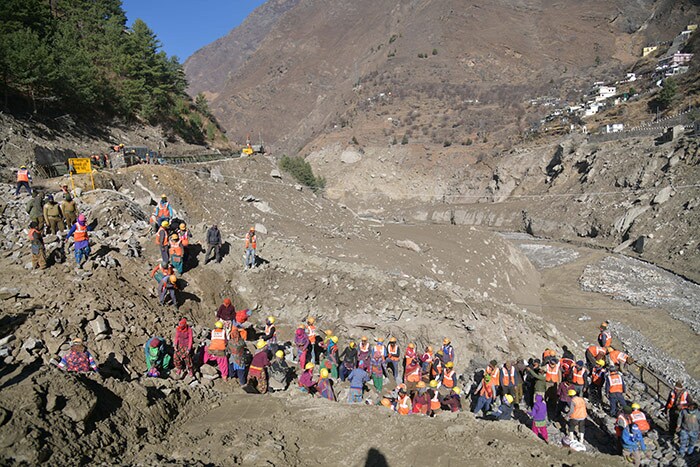 Border Roads Organisation (BRO) workers rebuild the destroyed Raini bridge in Chamoli district on February 13, 2021 after Raini bridge was washed away by a flash flood thought to have been caused when a glacier burst on February 7.