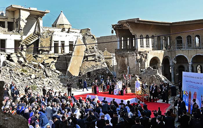 Pope Francis speaks at a square near the ruins of the Syriac Catholic Church of the Immaculate Conception (al-Tahira-l-Kubra), in the old city of Iraq's northern Mosul on March 7, 2021.