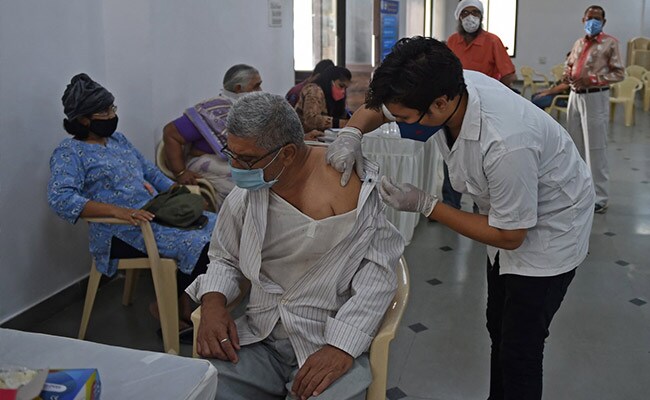 A health worker inoculates a man with the dose of Covid vaccine in Ahmedabad.