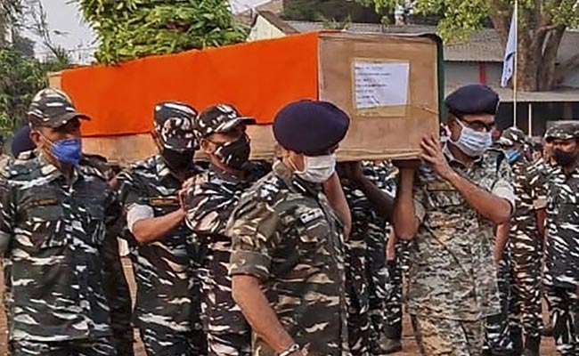 Security forces carry the coffin of their colleague, who died following a gun battle with Maoists in Chhattisgarh.