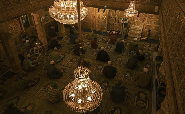 Devotees offer prayers maintaining social distance to contain the spread of the Covid, at a mosque in Srinagar.