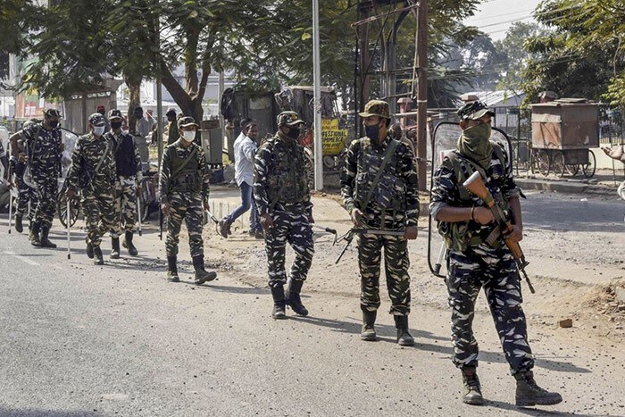 CRPF personnel conduct a flag march during counting in Patna