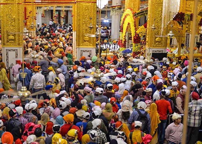 Devotees offer prayers at Gurdwara Bangla Sahib in New Delhi on Tuesday.