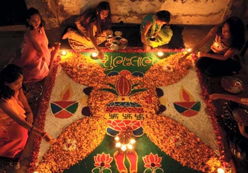 <b>Rangoli hues</b>: A group of women from Chennai decorate their floors with Rangoli. <I>(AP)</I>