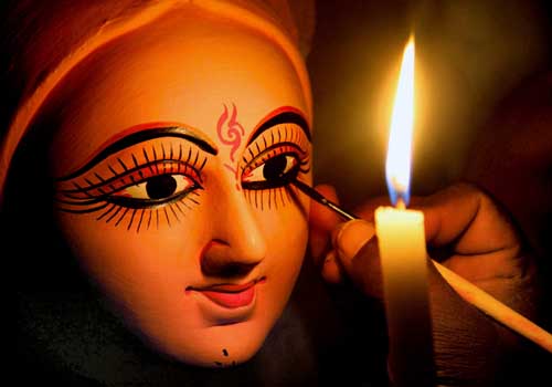 <b>Divine beauty</b>: An artist gives finishing touches on a clay idol of the Goddess Laxmi, ahead of Diwali festival in Patna.<I> (PTI )</I>