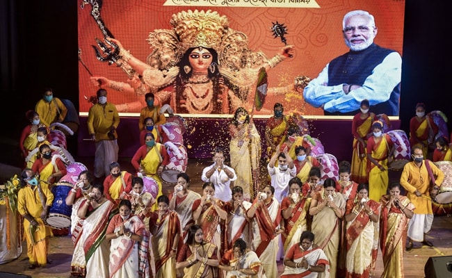 BJP Mahila Morcha members attend the virtual inauguration of BJP Cultuaral Cell's Durga Puja pandal by Prime Minster Narendra Modi, in Kolkata. PM Modi inaugurated Durga Puja pandals in Kolkata via video conferencing as the five-day celebrations begin in West Bengal amid the pandemic.