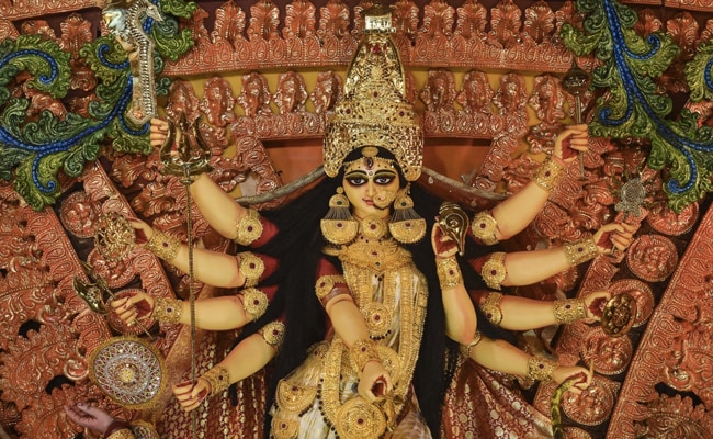 Idol of Goddess Durga at a community puja pandal during Durga Puja festival in Kolkata. The eight consorts of Goddess Durga - Brahmani, Maheswari, Kaumari, Vaishnavi, Varahi, Narasinghi, Indrani and Chamunda - are worshipped on Ashtami.