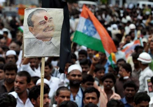 A placard bearing the portrait of Y S Rajasekhara Reddy is seen during a funeral procession in Hyderabad. (AFP Photo)