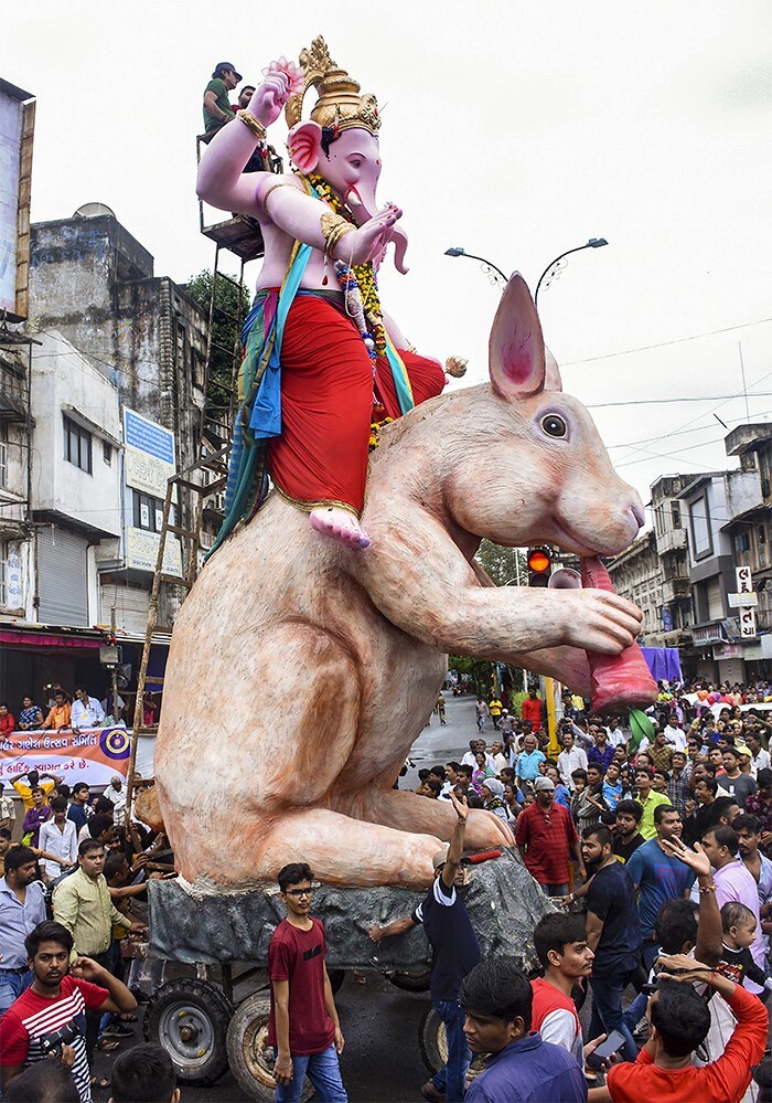 Devotees carry an idol of Lord Ganesh for immersion, on the occasion of 'Anant Chaturthi' in Surat, Gujarat