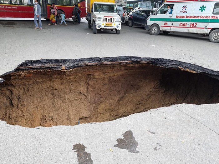 A massive hole can be seen under the flyover