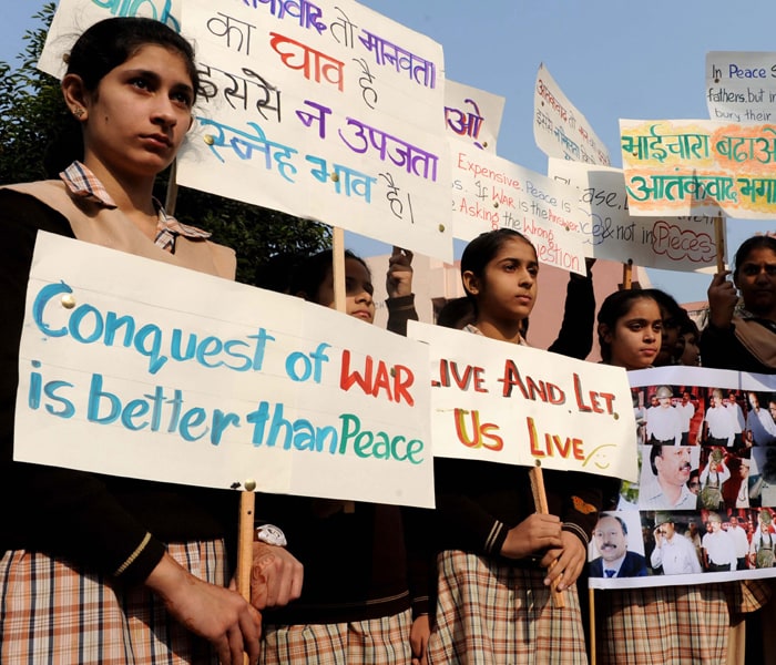 And school children were also out this morning, on the streets in front of the century old, terror struck Taj Hotel paying tribute to all those who lost their lives last year in the attacks. (AFP Photo)