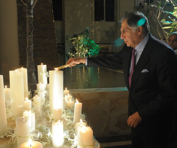 Chairman of the Tata Group, Ratan Tata, held a memorial service at the Taj Hotel on the first anniversary of 26/11. The Taj was the worst hit in those attacks, taking maximum damage to its Heritage wing.<br><br>Seen here, Ratan Tata lighting a candle in memory of the victims and paying a fitting tribute to the courage displayed by staff members of Taj. (AFP Photo)