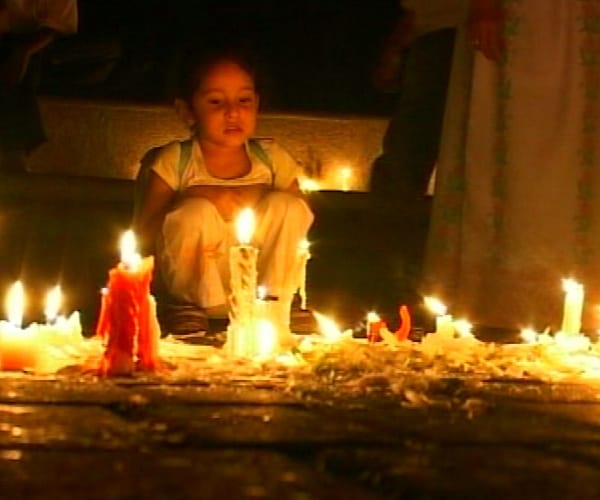 At New Delhi's Select City Walk mall, people turned out in big numbers. A young girl can be seen here lighting a candle on the first anniversary of the 26/11 attacks. (NDTV Photo)