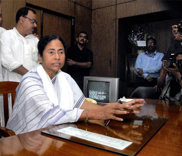 Mamata, the new Chief Minister of West Bengal sitting in her chamber at the Writers' Buildings.<br/><br/> This served as redemption of a pledge she made 18 years ago - not to enter as long as the Left was in power - after she was allegedly driven out of the building for protesting. Not only is the Left out of Writers' Buildings, but Mamata turned out to be the single most important person behind their removal.