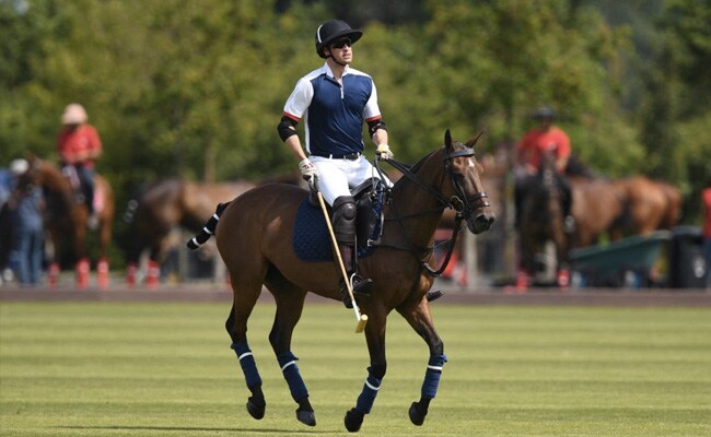 Britain's Prince William, Duke of Cambridge, warms up ahead of the Royal Charity Polo Cup 2021 match at the Guards Polo Club in Windsor, Berkshire on July 9, 2021.