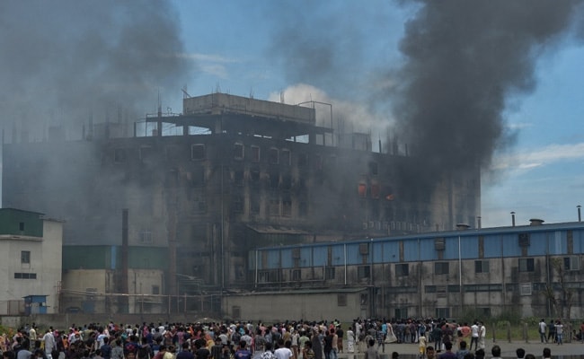 Smoke billows from a massive fire that broke out a day before in a factory in Bangladesh's Narayanganj district on July 9, 2021 that has claimed 52 lives.