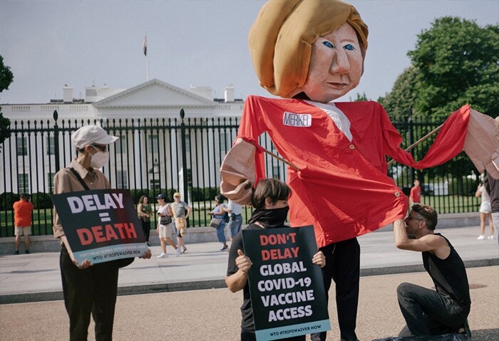 An effigy of German Chancellor Angela Merkel is displayed during a protest calling for suspension of intellectual property protections for Covid-19 vaccines, in front of the White House on July 15, 2021. The demonstration coincides with the visit of Chancellor Merkel to Washington.