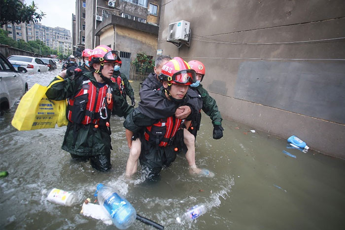 Rescuers evacuating residents at a flooded area in China's eastern Jiangsu province, after heavy rains brought by the passage of Typhoon In-Fa inundated the eastern coast of China.