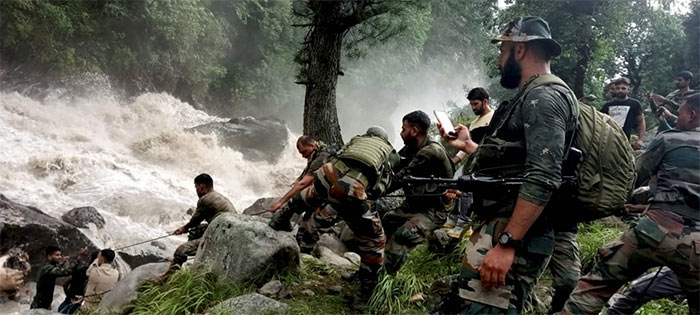 Indian Army personnel during a rescue operation after flash floods due to a cloudburst at Hanzor in Kishtwar district of Jammu and Kashmir.
