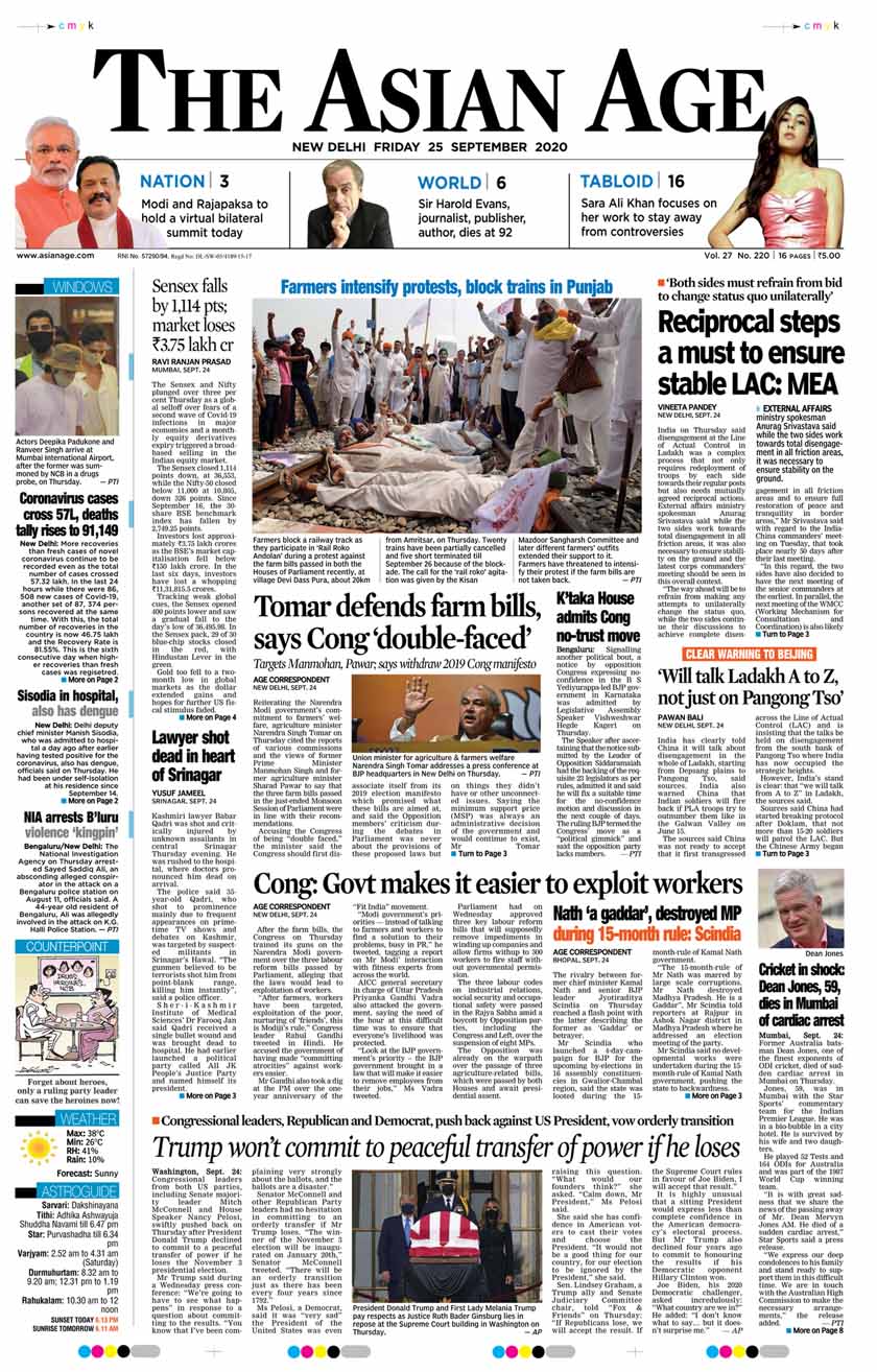 Farmers block a railway track as they participate in 'Rail Roko Andolan' during a protest against the farm bills passed in both the Houses of Parliament recently, at village Devi Dass Pura, about 20km from Amritsar, on Thursday.