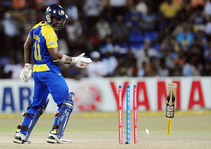 Sri Lankan captain Kumar Sangakkara is dismissed by Indian bowler RP Singh during their Tri-Nation Championship Trophy final ODI match in Colombo on Monday. (AFP Photo)