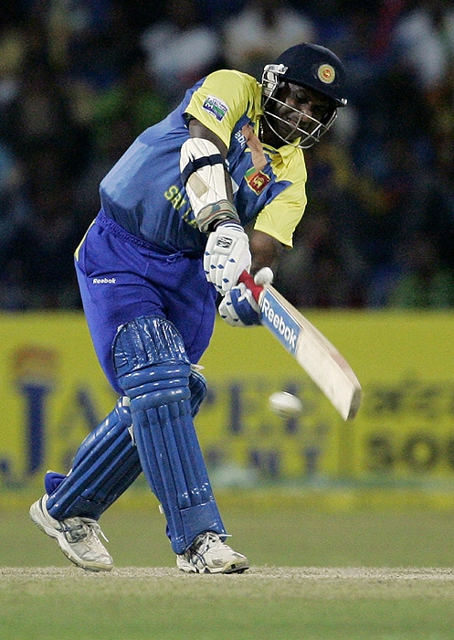 Sri Lanka's Sanath Jayasuriya plays a shot during the Tri-Nation Championship Trophy final ODI match against India in Colombo on Monday. (AP Photo)