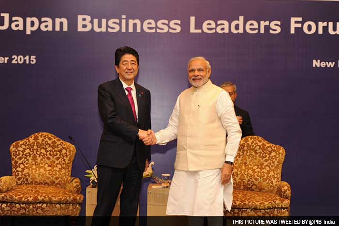 PM Narendra Modi shakes hand with Japan PM Shinzo Abe at the Business Leaders Forum. The two leaders are expected to seal a Rs. 98,000 crore deal for India's first bullet train track and deliberate on a civil nuclear pact.