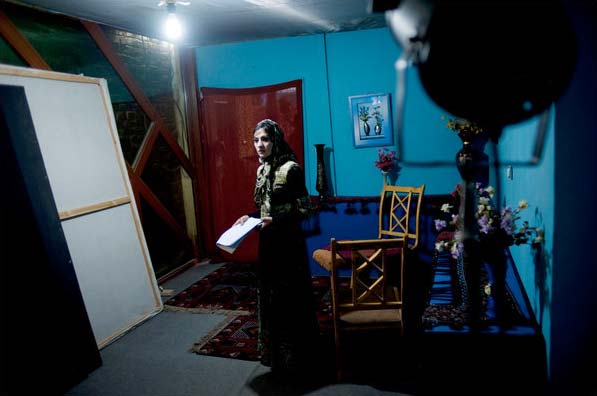Women working on Afghanistan's first TV soap opera, ?The Secret of This House,? face public scorn, being ostracized, even death threats. Their families often don't want them to appear on TV. But, they still go on. <br> <br> In this picture, 19-yr-old Arzoo, one of the main actresses, is seen on set of the show. When she started taking roles, her uncle tried to kill her, and the neighbours beat up taxi drivers who took her home. But she refused to give up. <br> <br> ?My father said if you are happy to work in films you are dead for us, you are not our daughter,? she said. (NYT PHOTO)