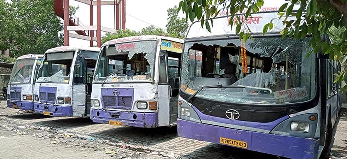 Buses vandalised in Varanasi during protests against 'Agnipath' scheme.