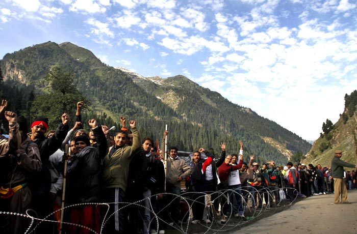 Amidst chants of 'Bum Bum Bole', over 22,000 devotees set off from Baltal and Pahalgam base camps on Wednesday for pilgrimage to the Amarnath cave shrine, marking the formal start of the annual yatra. (AP Photo)