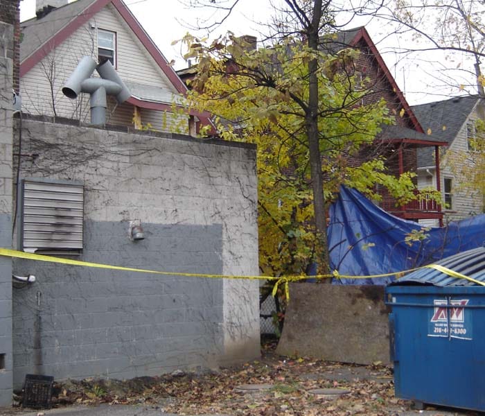 The area around the residence of the alleged serial killer Anthony Sowell is sealed off with the police tape in Cleveland, Ohio. A US judge charged Sowell with five counts of murder and refused him bail as investigators examined the gruesome remains of up to 11 victims found at his Cleveland home. "This is without question the most serious set of allegations I've been exposed to," said Judge Ronald Adrine, refusing bail due to the macabre nature of the crimes and defendant Anthony Sowell's past criminal history. (AFP Photo)