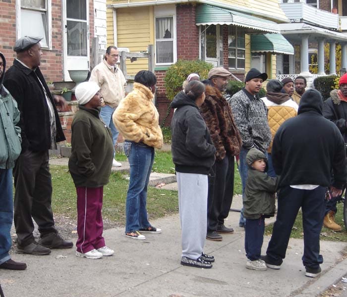 People gather near the residence of convicted rapist and alleged serial killer Anthony Sowell. (AFP Photo)