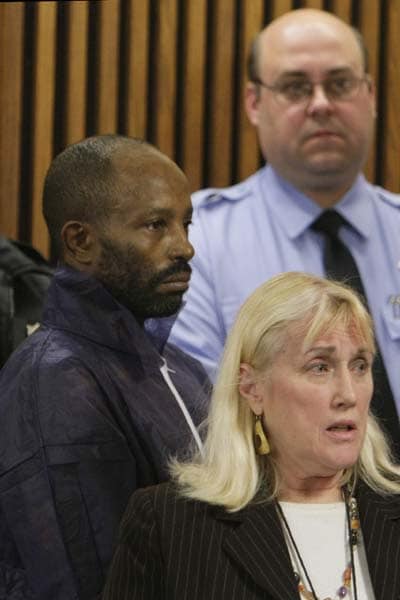 Anthony Sowell, right, stands behind public defender Kathleen DeMetz during a court appearance , in Cleveland. Sowell was ordered held without bond.  (AP Photo)