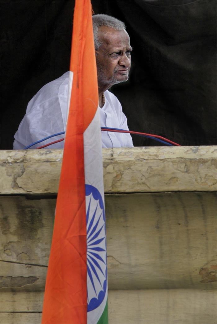 On the ninth day of his hunger strike against graft, Anna Hazare appears on stage at the Ramlila Ground.