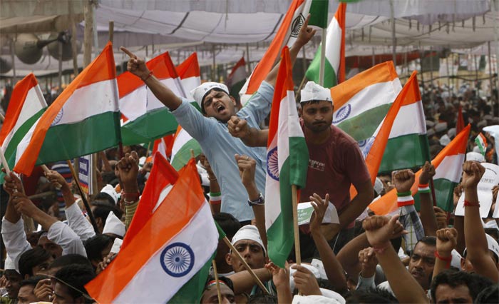 Supporters of Anna Hazare raise slogans at Ramlila Ground.