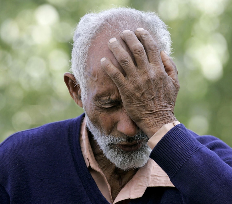 Kashmiri farmer Atta Mohammed, 70, gestures as he speaks to the Associated Press at a
graveyard where he says he has helped bury 235 unidentified dead. Human rights workers say that in the past 18 months they have identified dozens of burial grounds where they believe Indian security forces dumped more than 2,400 corpses. (AP Photo)