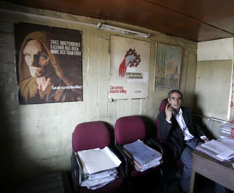 In this photo taken October 9, 2009, Pervez Imroz, legal aide of the Association of Parents of Disappeared Persons speaks during an interview with the Associated Press in Srinagar. In a region struggling to emerge from two decades of violence that has left 68,000 people dead, the graveyards have deeply shaken Kashmir, digging up memories of the estimated 10,000 people who disappeared at the height of the fighting. (AP Photo)