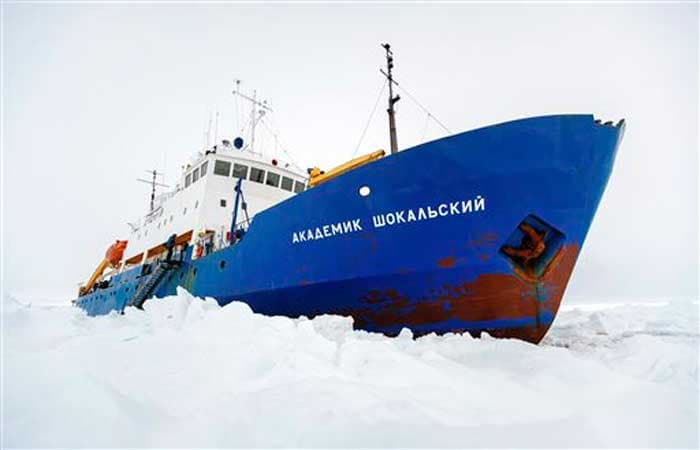 All 52 passengers who spent Christmas and New Year trapped on an icebound Russian research vessel in Antarctica were airlifted from the ice on January 2, 2014 in a dramatic rescue mission. A Chinese helicopter which landed on a makeshift landing pad next to the marooned ship ferried the scientists, tourists and journalists in groups of 12 to an Australian government supply ship, the Aurora Australis. The passengers were stranded for 10 days on the Russian ship.<br><br>In this December 27, 2013 file photo provided by Australasian Antarctic Expedition/Footloose Fotography, the Russian ship MV Akademik Shokalskiy is trapped in thick Antarctic ice 1,500 nautical miles south of Hobart, Australia.