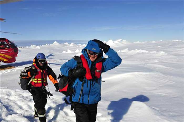 In this photo provided China's official Xinhua News Agency, the first group of passengers aboard the trapped Russian ship MV Akademik Shokalskiy arrive at a safe surface off the Antarctic on January 2, 2014.