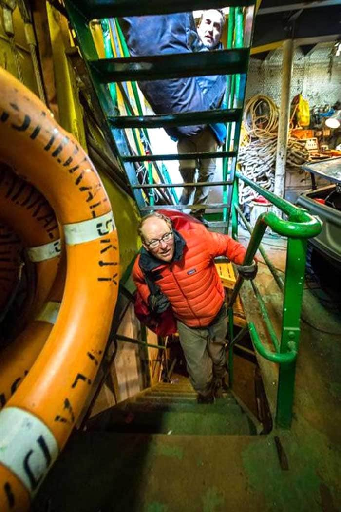 Chris Fogwill (bottom) and Chris Turney, co-leaders of the Australasian Antarctic Expedition, are pictured below deck in the front hold of the stranded Akademik Shokalskiy in Antarctica on December 30, 2013.