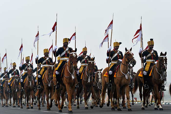 Mounted Indian Army personnel march on horseback during the Army Day parade in New Delhi.