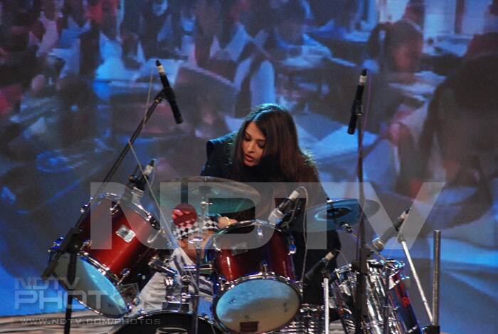 You can barely see the tiny tot that Ash is hugging behind the drum set but that's Anshuman, the little drummer boy, and he's all of three years old.