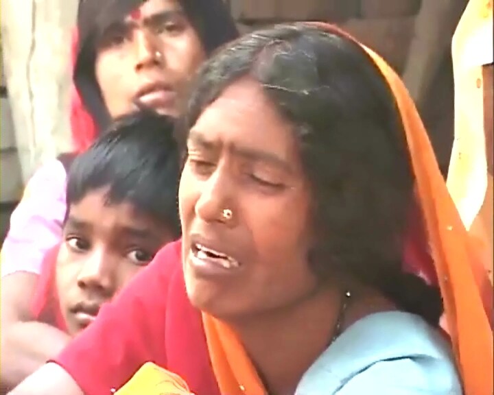 A woman is crying after losing her loved ones in the stampede. The tragic death of 63 people, mostly women and children, brings to light not just the pain of losing their loved ones, but the conditions that they live in.