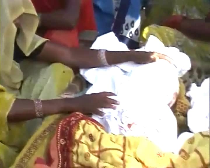 Families mourn the tragic death, those who were crushed to death at the gates of an ashram. These poor villagers had gone to collects food and alms. Everyone has lost someone. In every home scenes of mourning can be witnessed.