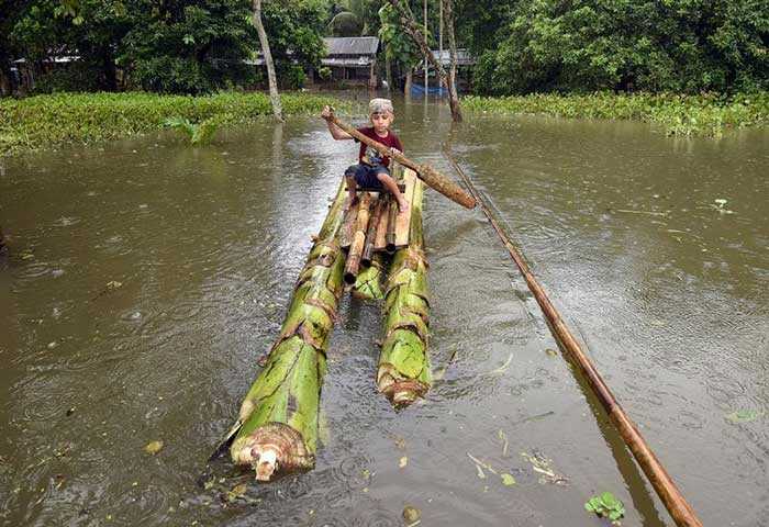 Pics: Floods Cause Havoc In Assam, Houses Evacuated