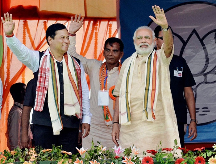 Prime Minister Narendra Modi with BJP's chief ministerial candidate Sarbananda Sonowal at an election rally for the upcoming Assembly polls in the Kalinagar district of Assam.