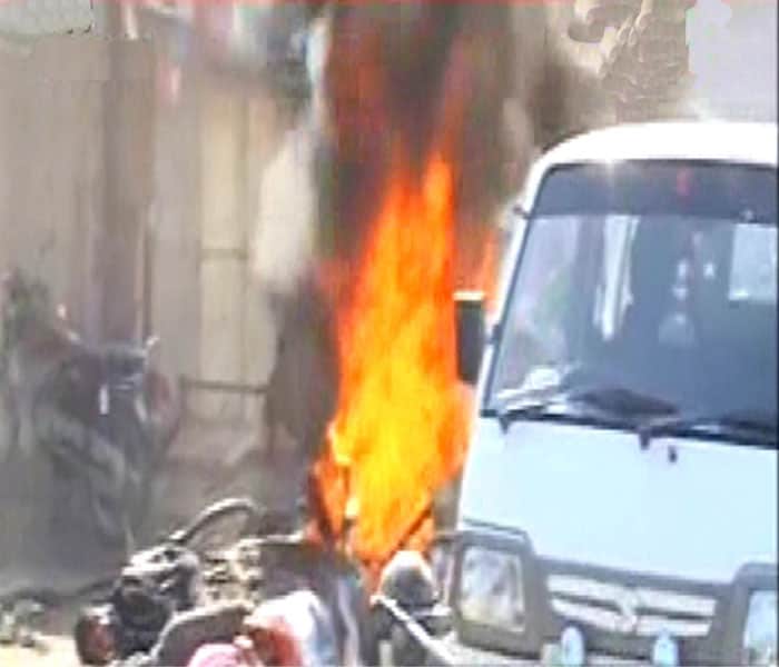 Four persons were killed and 20 others injured when suspected ULFA militants triggered two blasts close to a police station in lower Assam?s Nalbari district on Sunday.