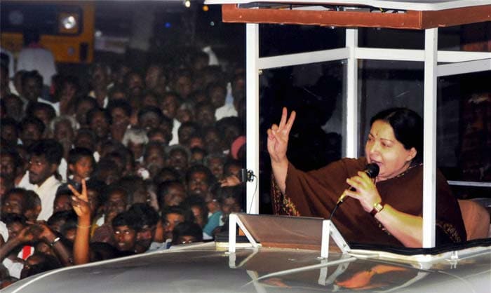 AIADMK General Secretary J Jayalalithaa addresses a rally in Tiruchirapalli from a newly-designed campaign van for the upcoming Tamil Nadu assembly polls. (PTI Photo)